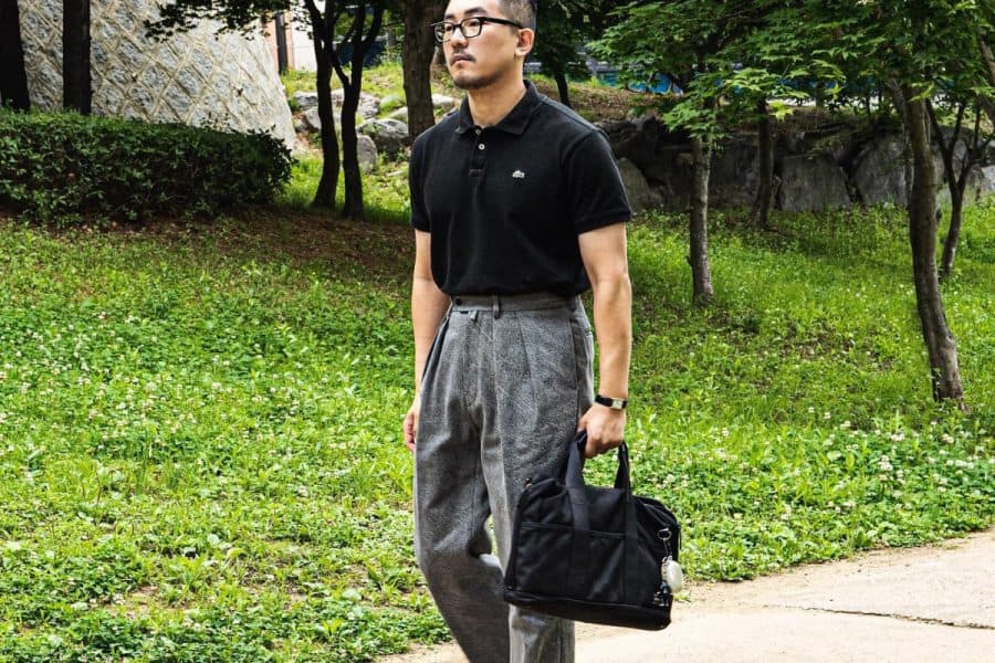 black polo with grey pants